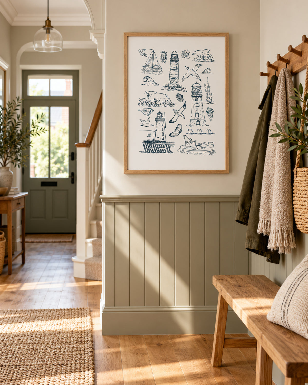Coastal lighthouse wall art displayed in a warm neutral hallway with wood panelling and relaxed seaside-inspired styling.