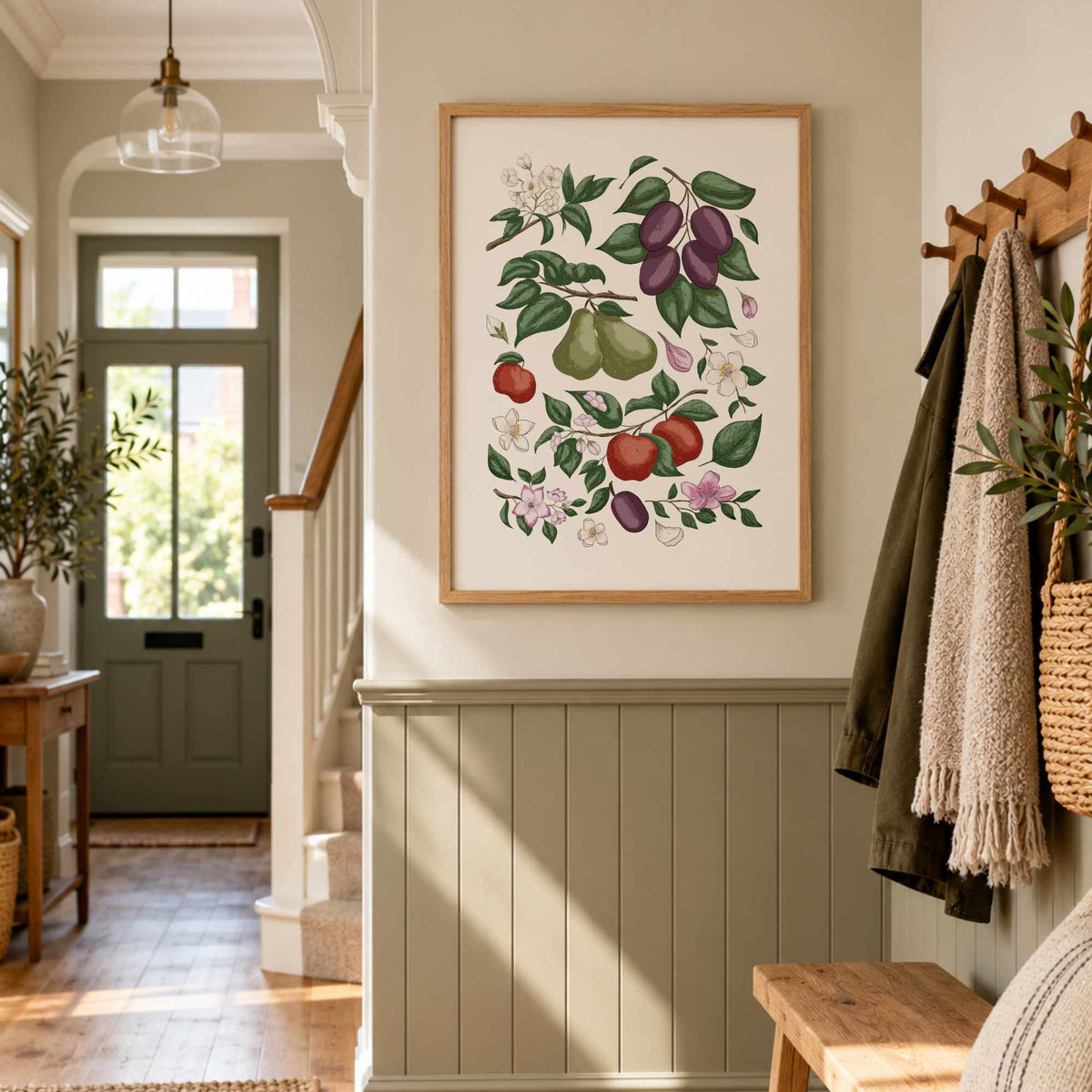 Hand-illustrated fruit and botanical print displayed in a warm neutral hallway with wood panelling.