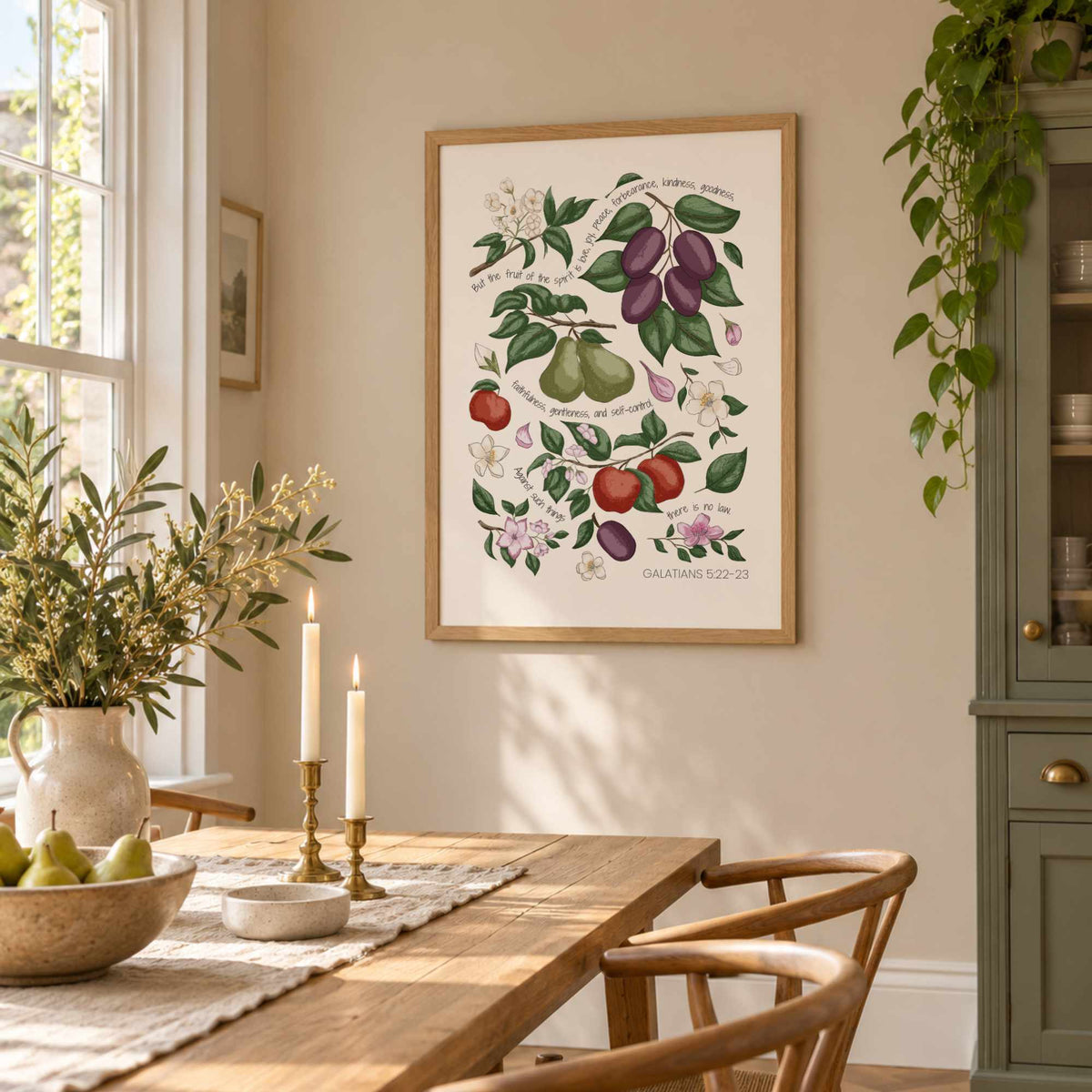 Botanical scripture wall art displayed in a bright dining room with natural wood furniture and warm cottage styling.