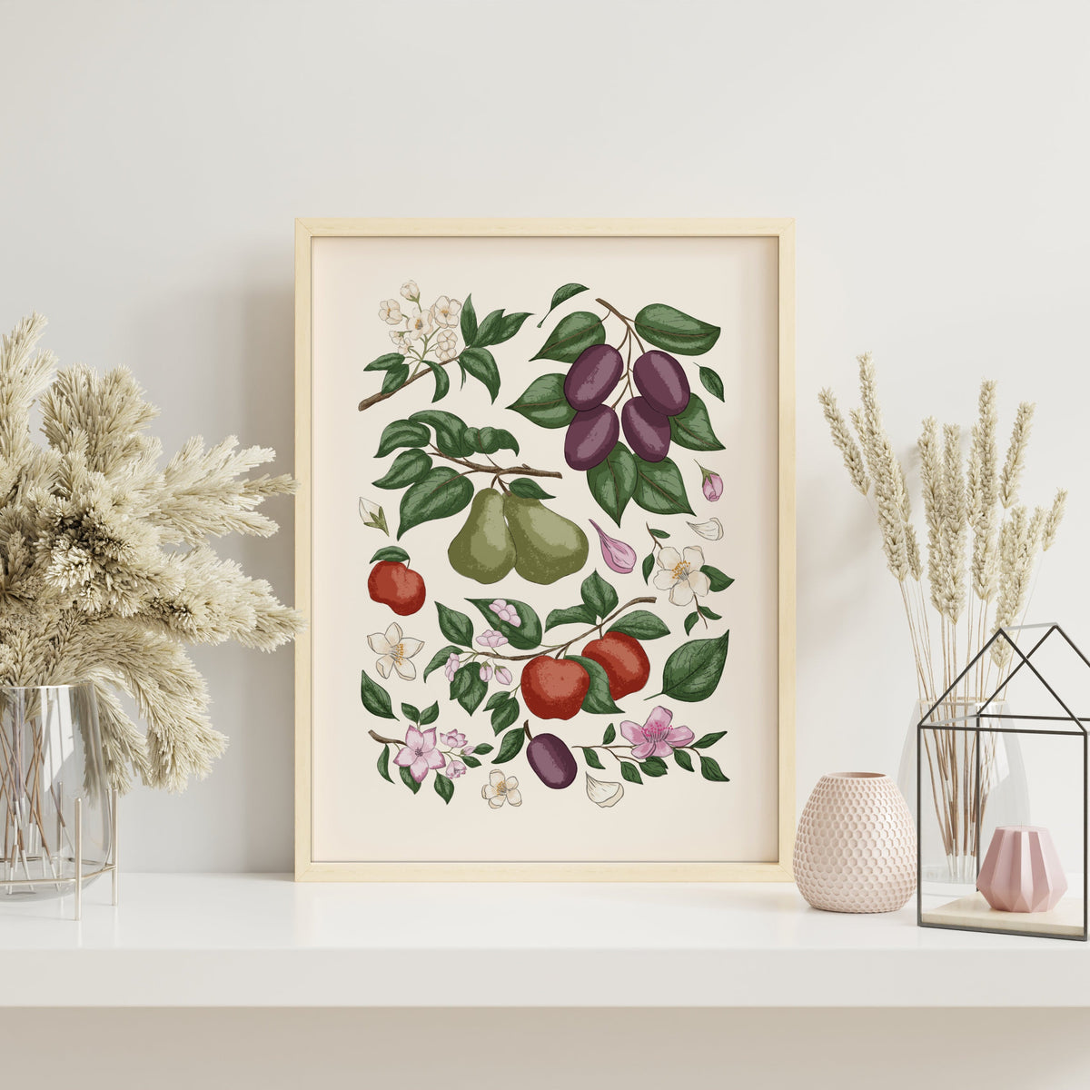Orchard fruit art print with hand-illustrated figs, plums, apples, pears and leafy botanical details in a light wood frame.