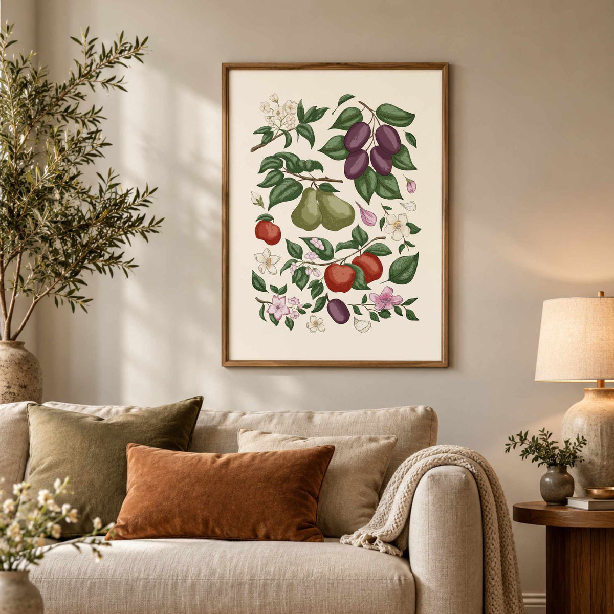 Fruit and botanical wall art displayed above a neutral sofa in a cosy living room with warm earthy decor.