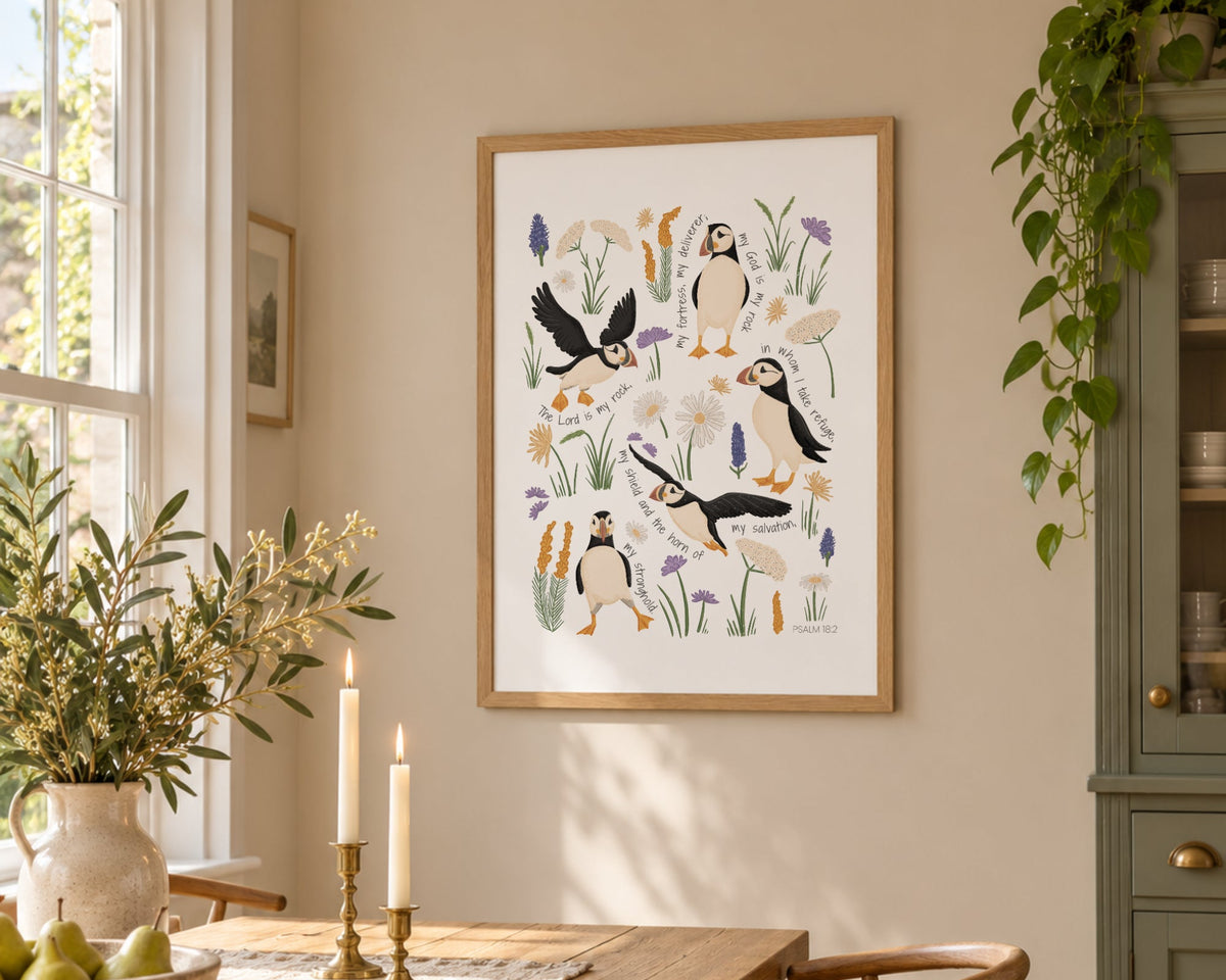 Puffin Christian wall art print with Psalm 18 scripture displayed in a bright dining room with warm wood and natural light.