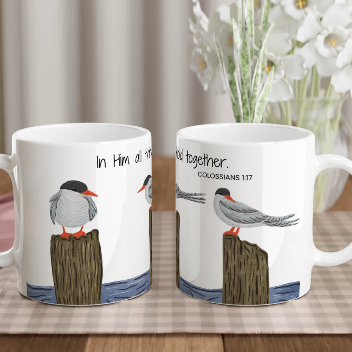 Two side-by-side views of the Arctic Tern faith mug displaying the full bird and scripture wrap.