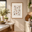Christian garden bird print displayed in a bright cottage-style kitchen with warm wood and soft neutral tones.