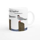 A white ceramic mug featuring an illustration of two seabirds perched on wooden posts with the text 'They hold together. COLOSSIANS 1:17' printed on the side, shown against a plain white background.