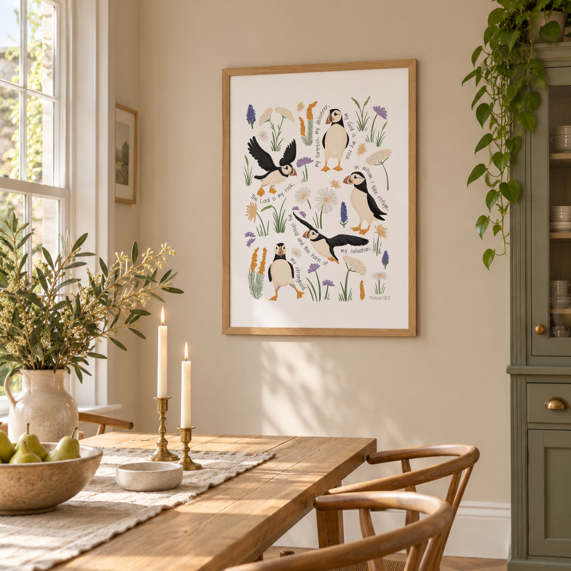 Puffin Christian wall art print with Psalm 18 scripture displayed in a bright dining room with warm wood and natural light.