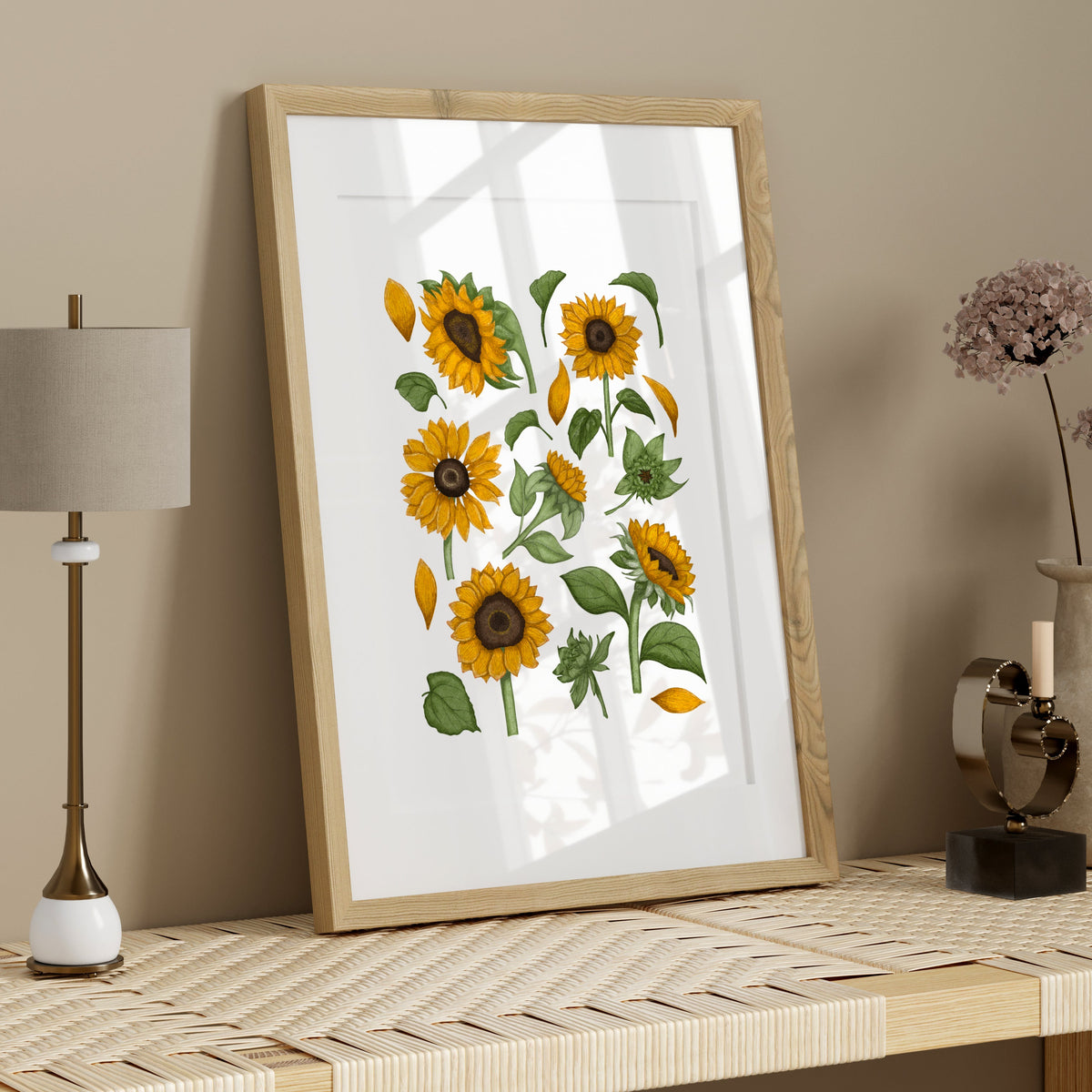 Golden sunflower botanical print displayed in a bright dining room with a wooden table, natural light and warm cottage-inspired styling.